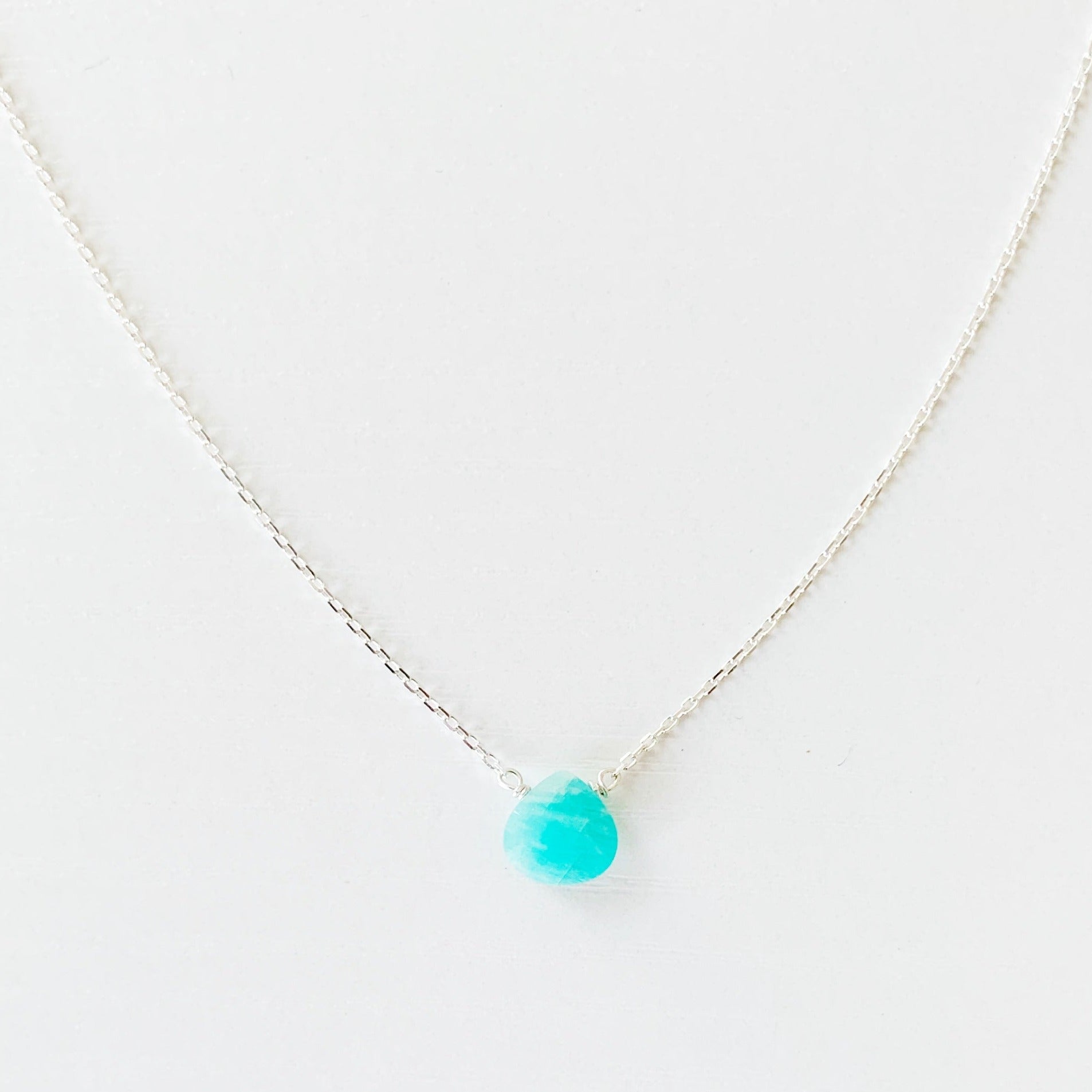 the captiva necklace by mermaids and madeleines is a small amazonite briolette on sterling silver chain. this necklace is photographed flat on a white surface